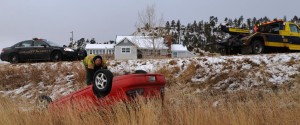 Caption: Montana Highway Patrol responded to an overturned vehicle Sunday morning on Pryor Creek Rd in Huntley. It appears that the driver of this red vehicle went off the Pryor Creek Rd and overturned the car, then walked away during the night as no one was present when Law enforcement arrived early. (Photo by Jonathan McNiven) 