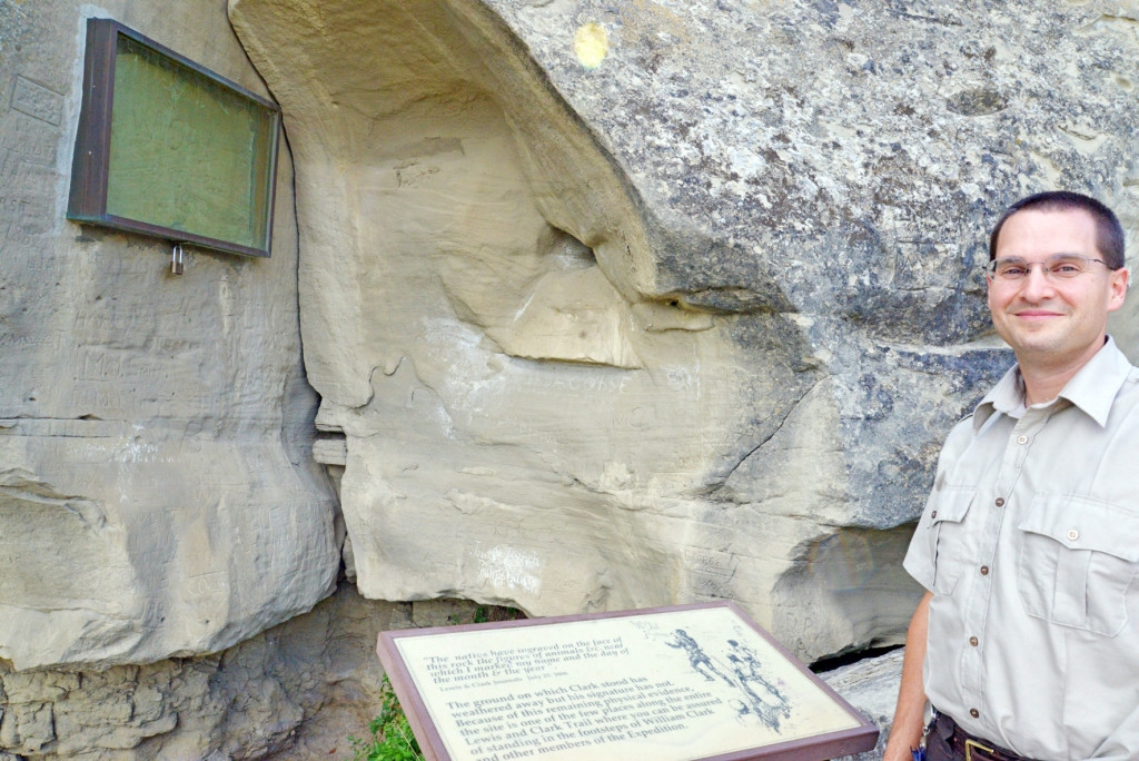 Jeff Kitchens, whose term as manager at Pompeys Pillar ends Saturday, is intrigued by years of efforts to preserve the signature carved in the rock face in 1806 by William Clark, seen here in a protective glass case. (Judy Killen photo)